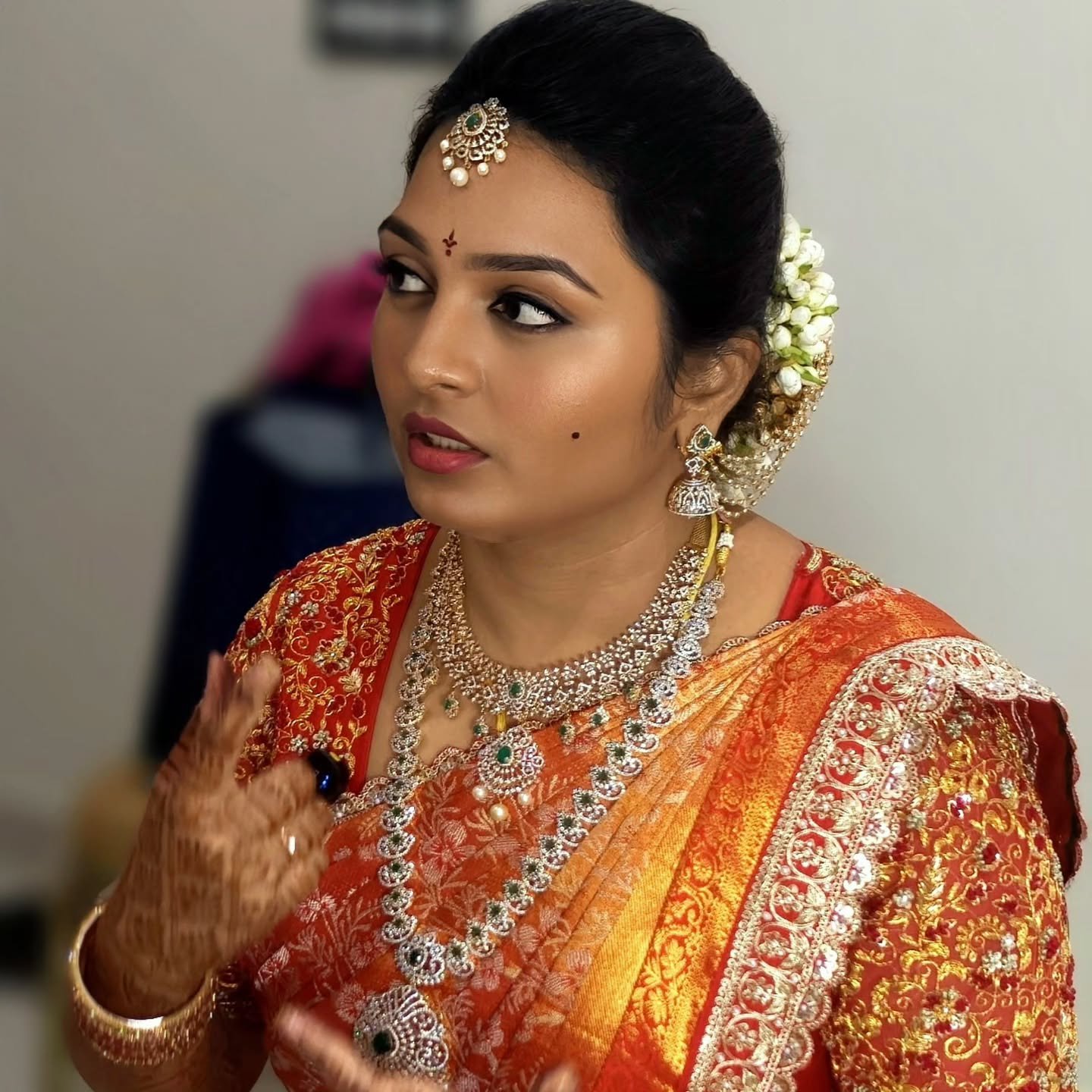 Bride in a red silk saree with temple jewellery